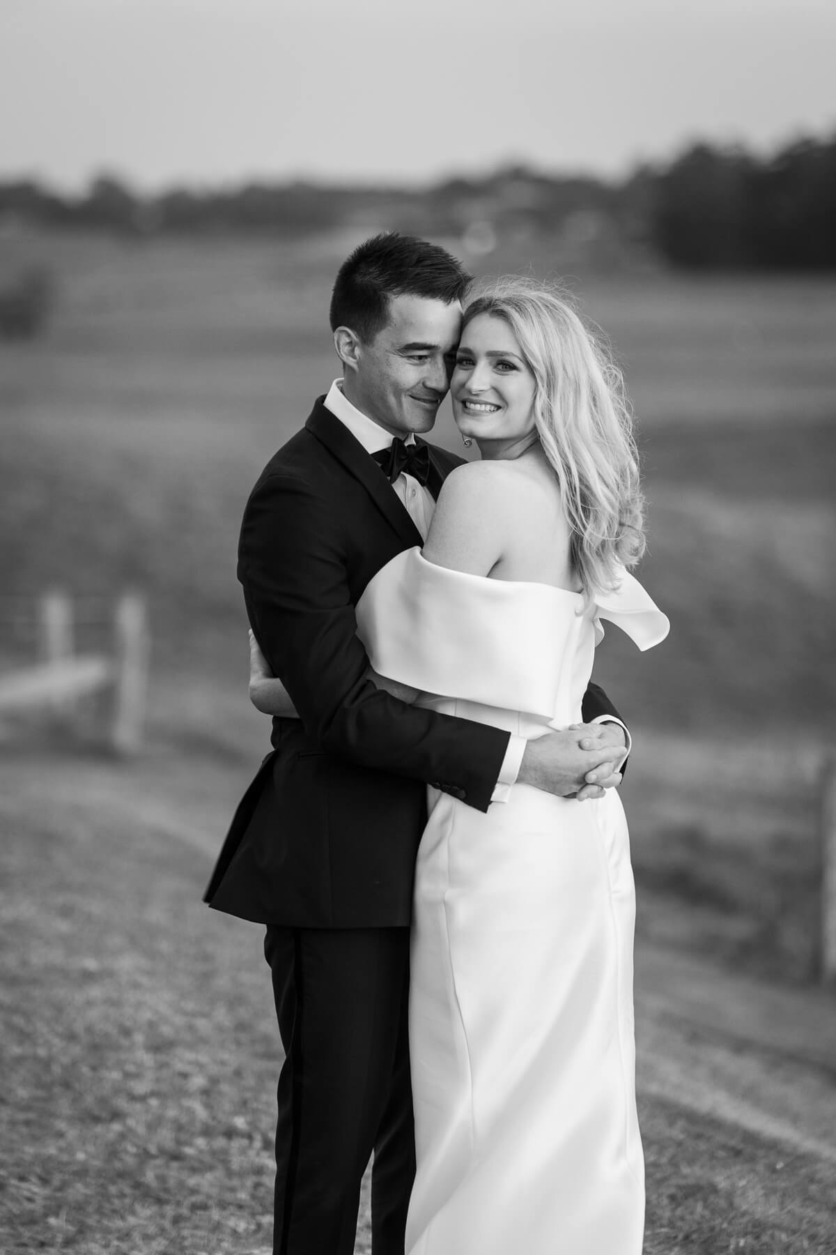 cate and rob enjoying their wallalong house wedding at sunset