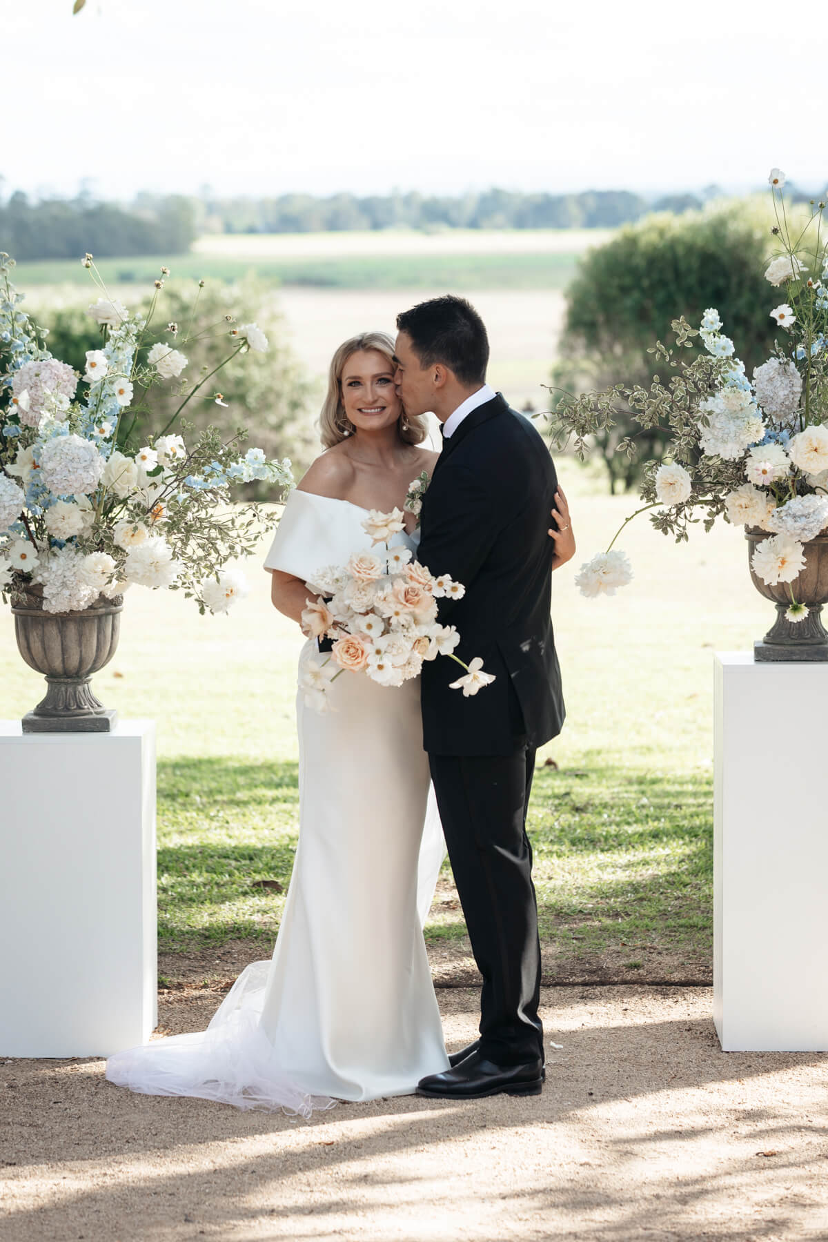 a moment between the couple at their wallalong house wedding