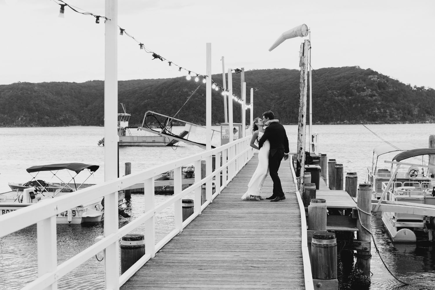 bride and groom on the jetty - palm beach wedding