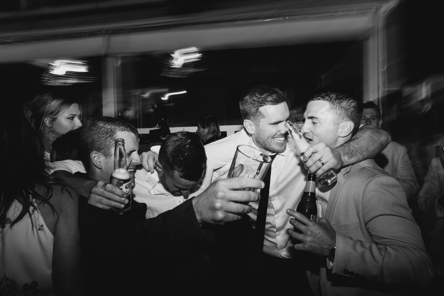 guests smiling and laughing on the dance floor - palm beach wedding