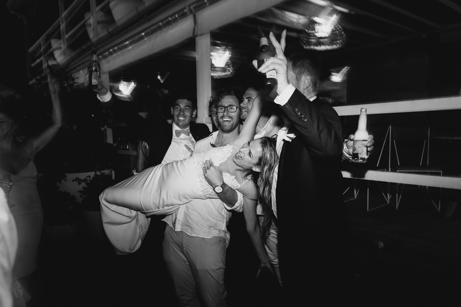 guests lifting the bride up - palm beach wedding