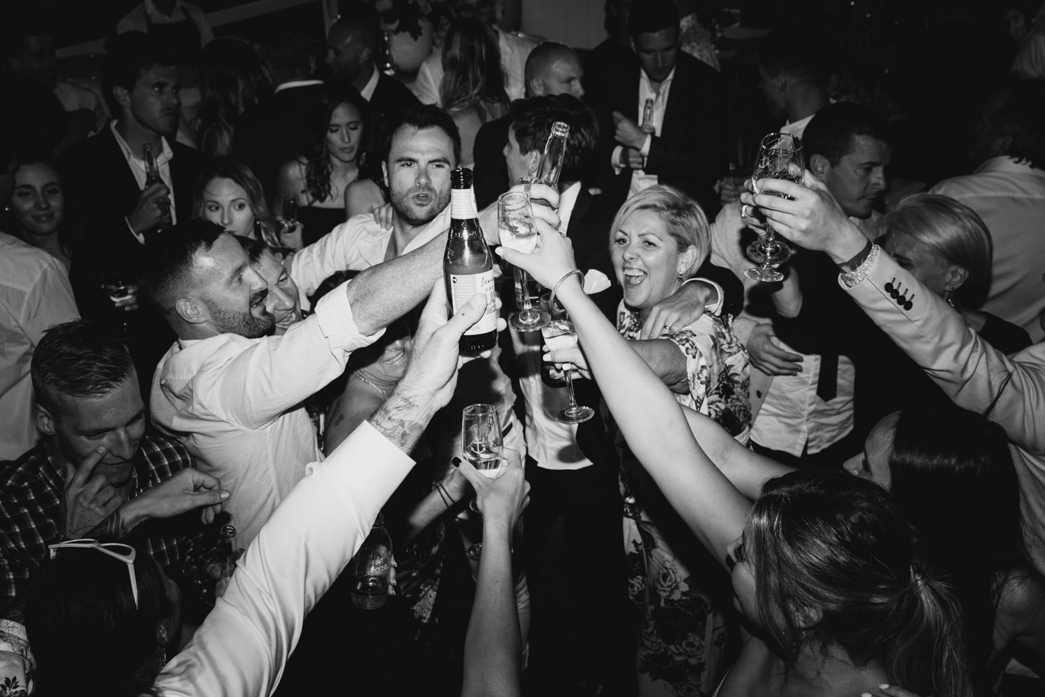 guests going for a cheers on the dance floor - palm beach wedding