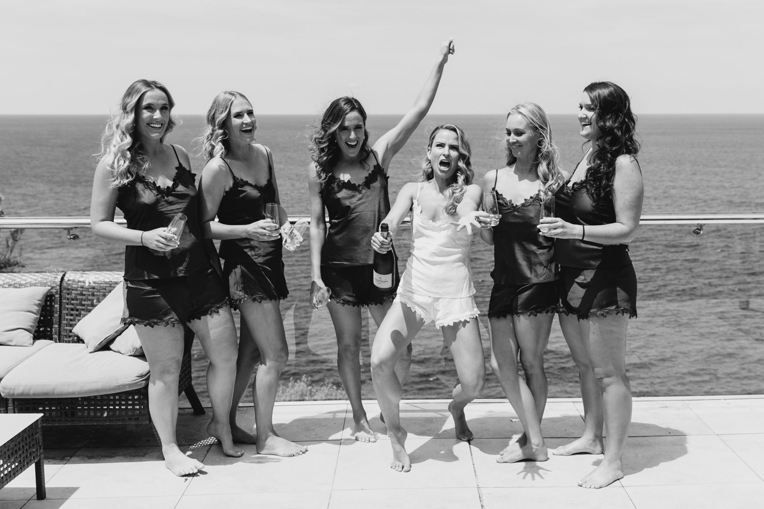 the girls popping a bottle of bubbles - palm beach wedding