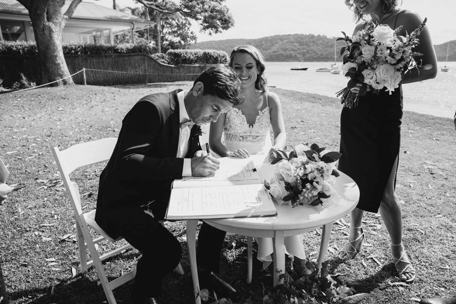 matt and jaqcui signing the documents - palm beach wedding
