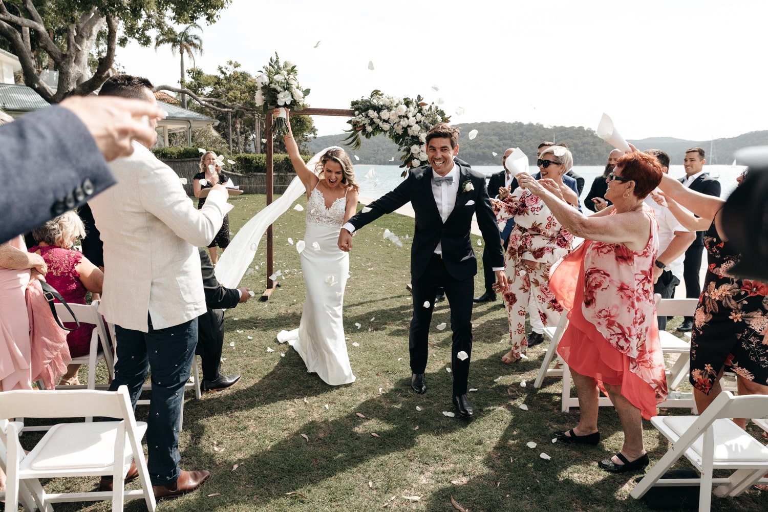 matt and jacqui walking down the isle - wedding photography style - palm beach wedding