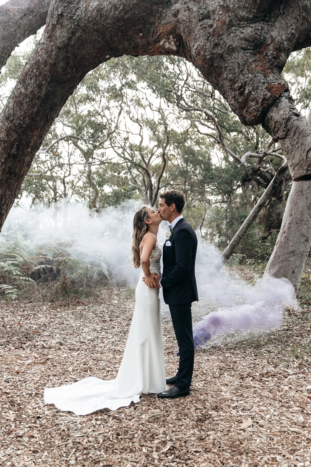 matt and jacqui with a smoke bomb - palm beach wedding