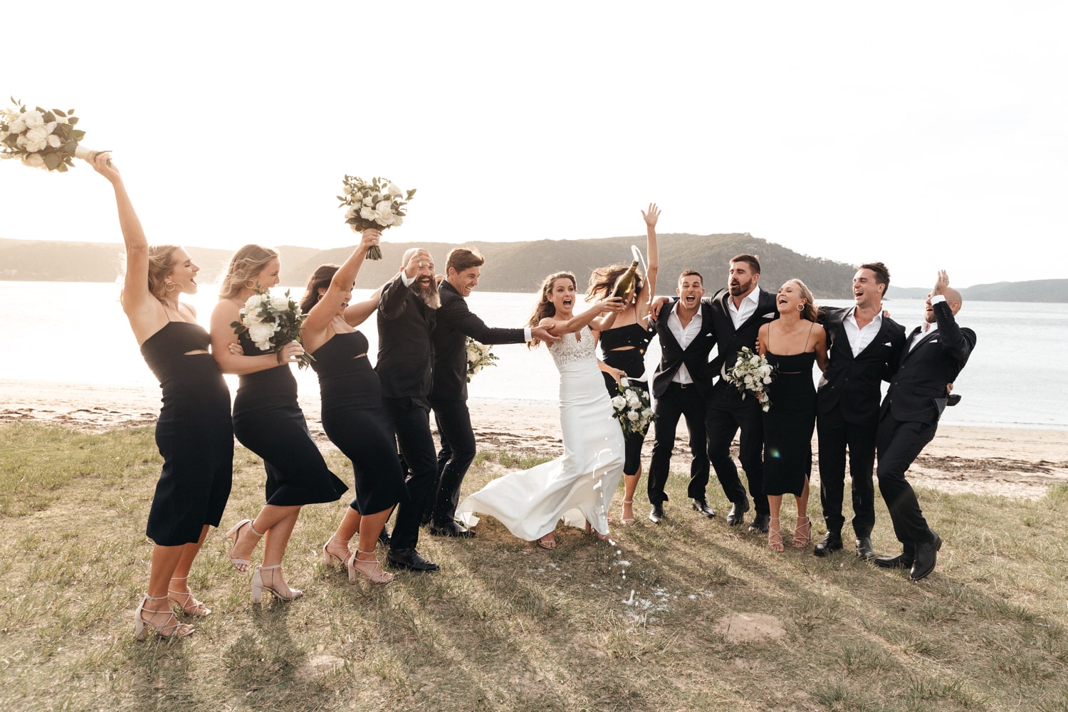 jacqui popping a bottle of bubbles - australian winter wedding -palm beach wedding