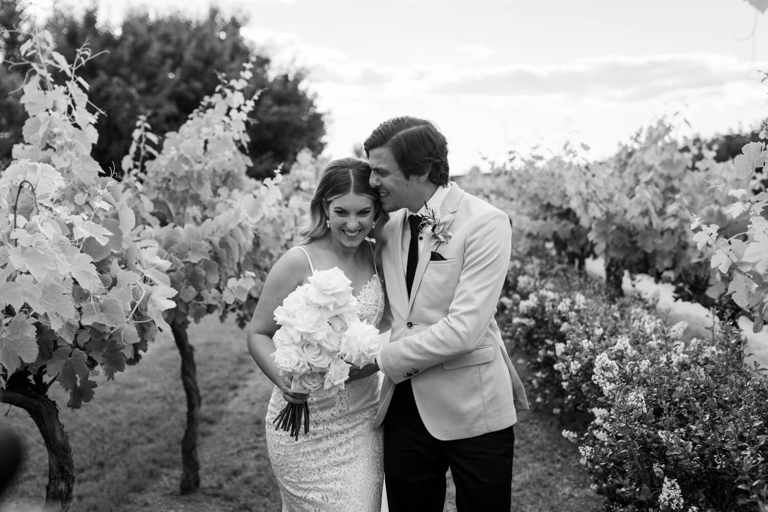 Courtney & Jake getting cute in the vinyards during their Blue Wren Mudgee Wedding