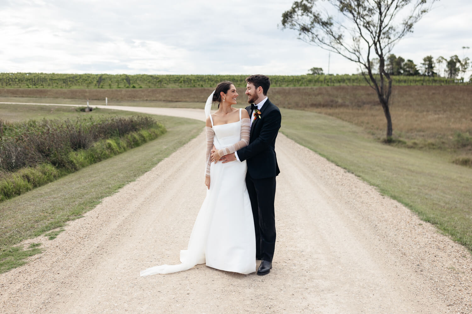 couple holding each other at squire's vineyard