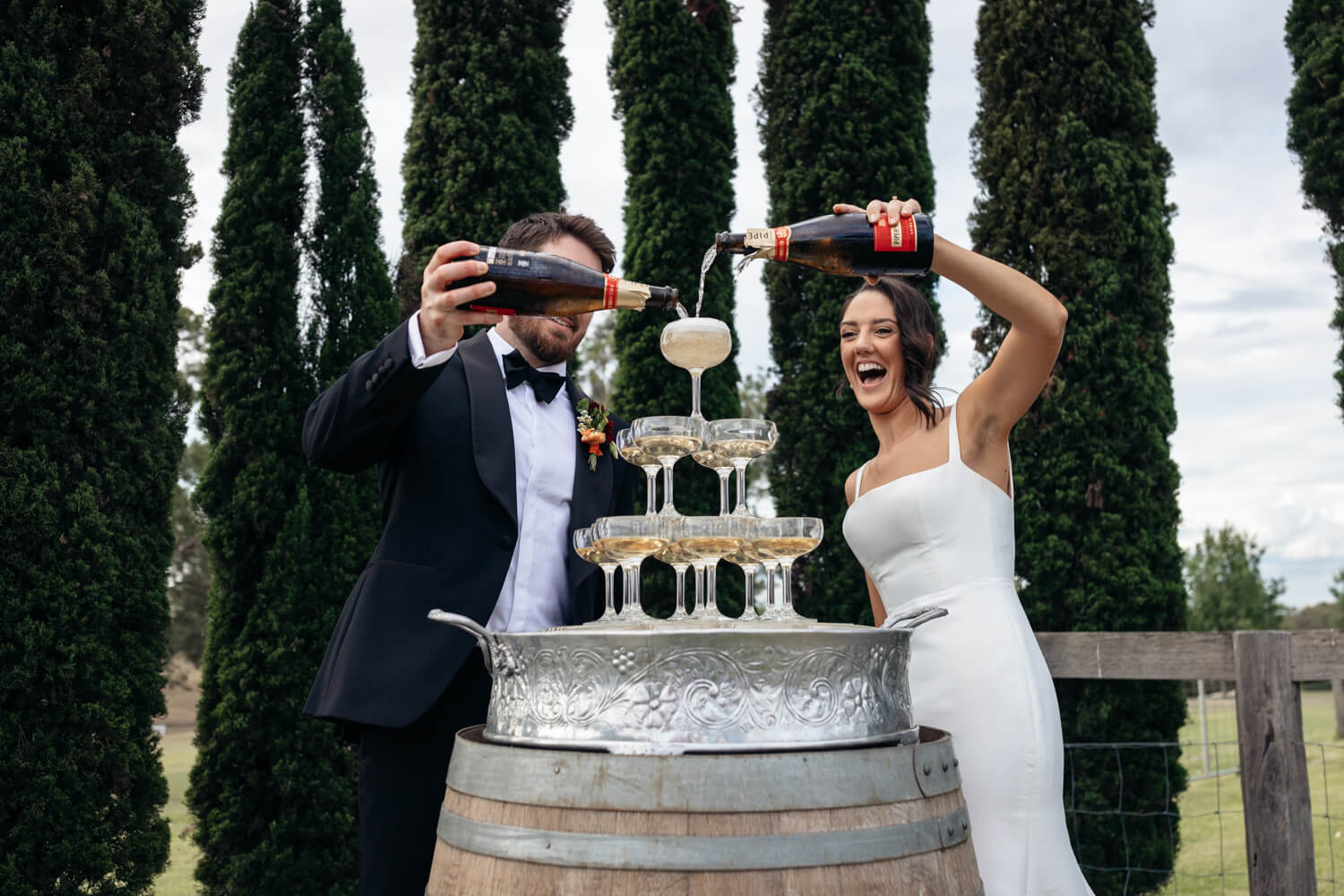 pouring champainge at their squire's vineyard wedding