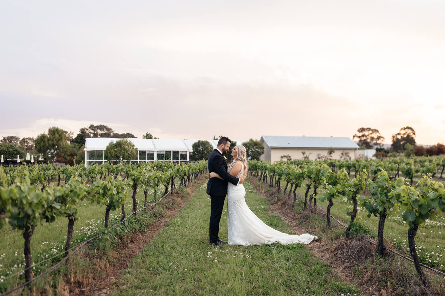 couple and a sunset at their peterson house wedding