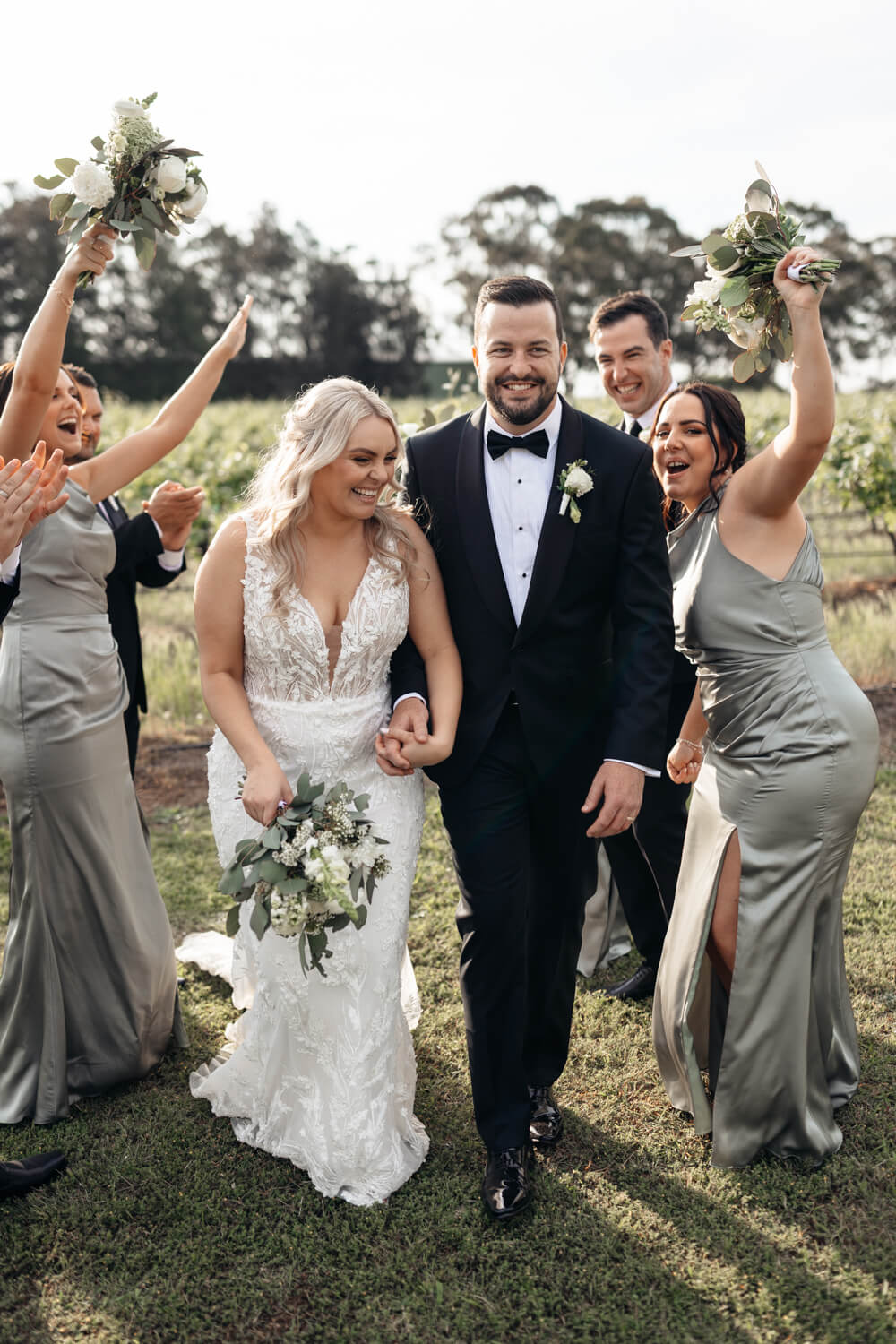 bride and groom and their bridal party at their peterson house wedding
