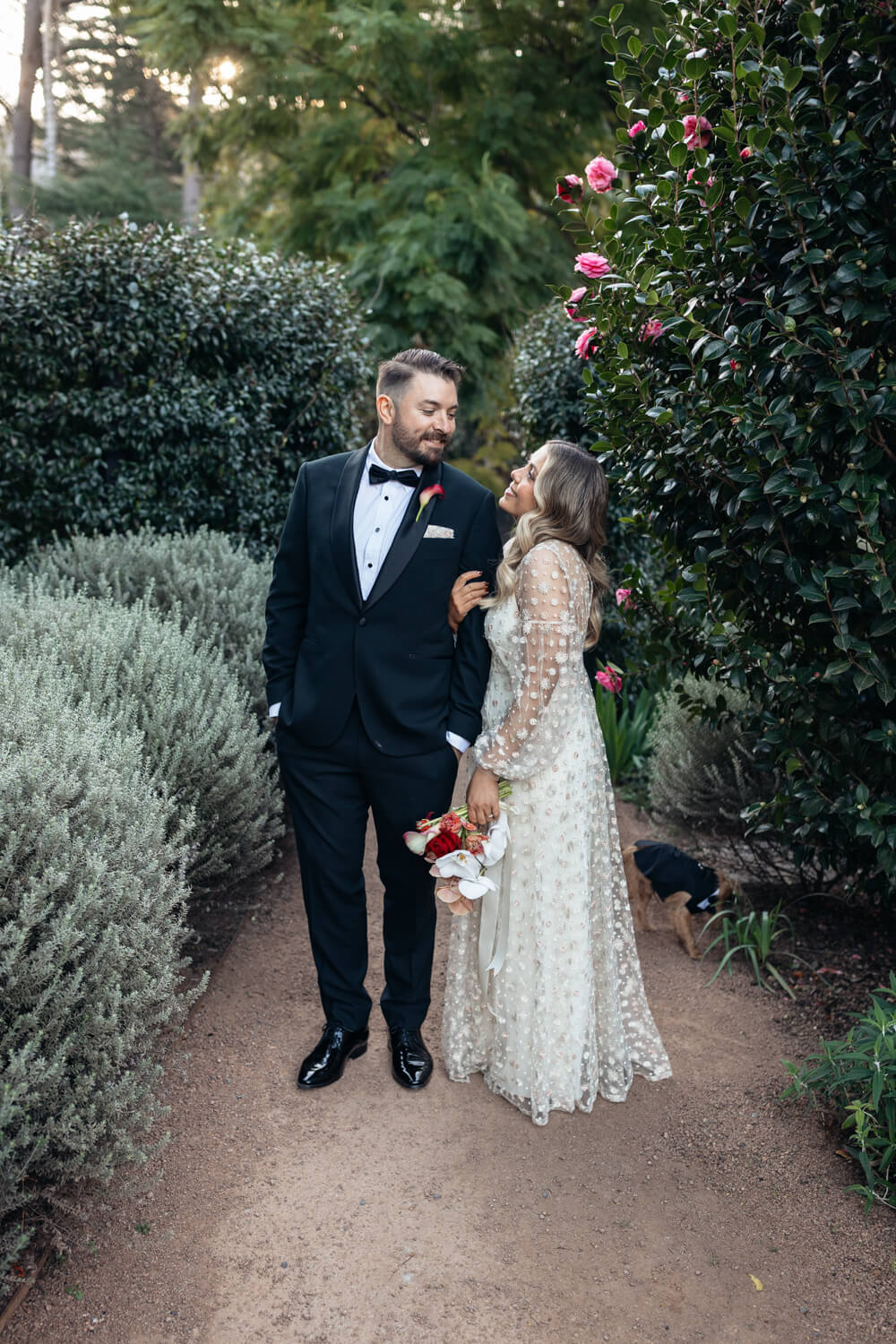 couple standing in the gardens at their lodge Jamberoo wedding