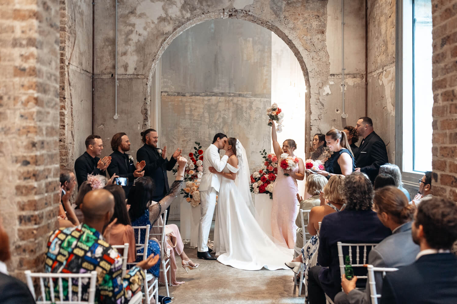 Couple kissing at their Events By Alpha Wedding ceremony