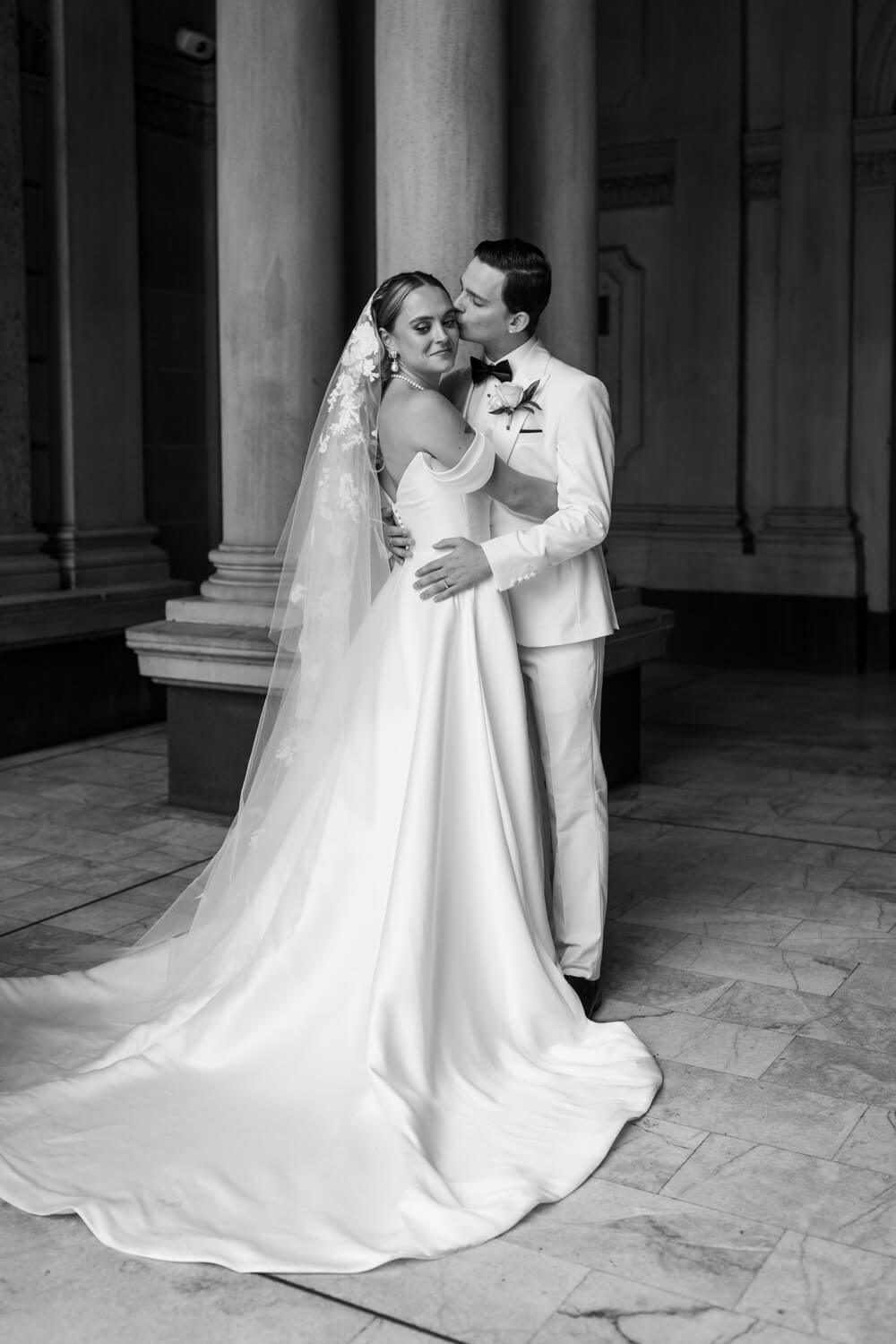 A black and white portrait of the bride and groom at Sydney's Town Hall