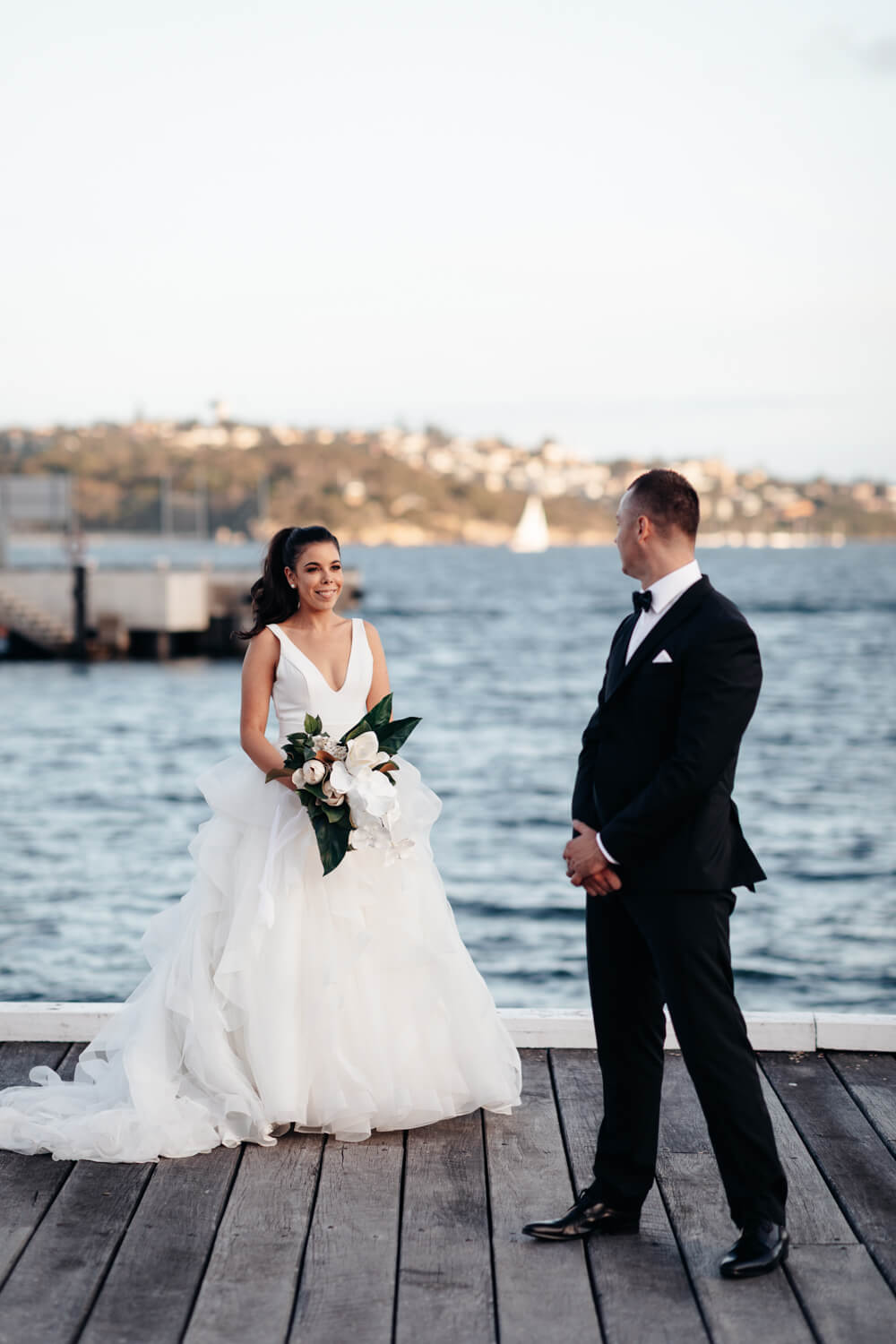 Groom looking at his bride during their Sergeants Mess wedding