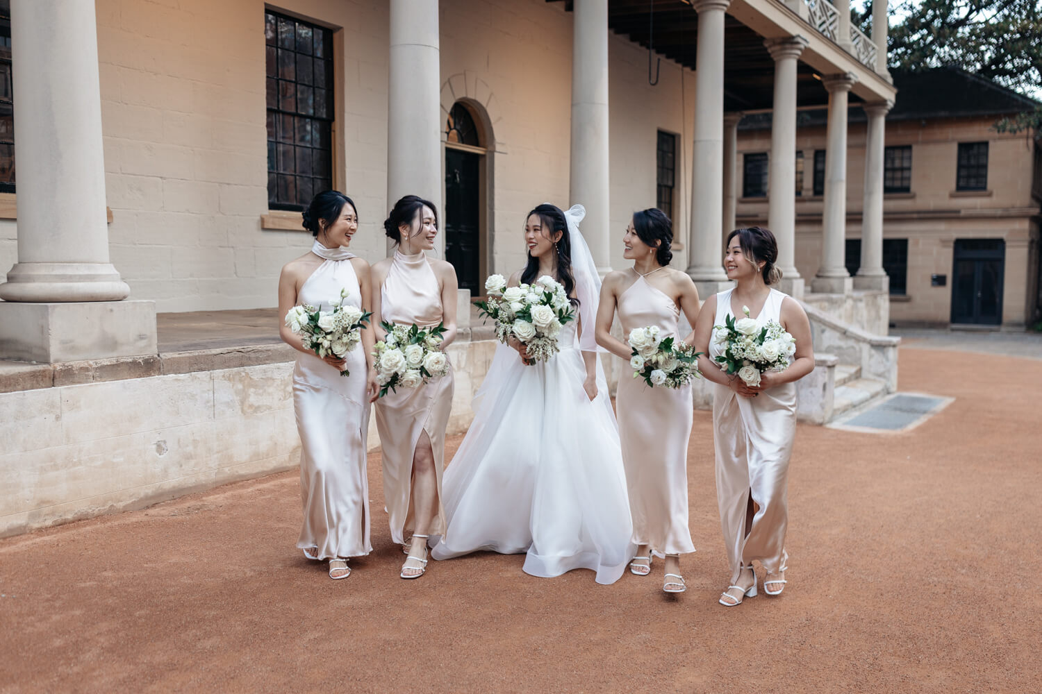 Bridemaids all walking together at The Mint during their wedding