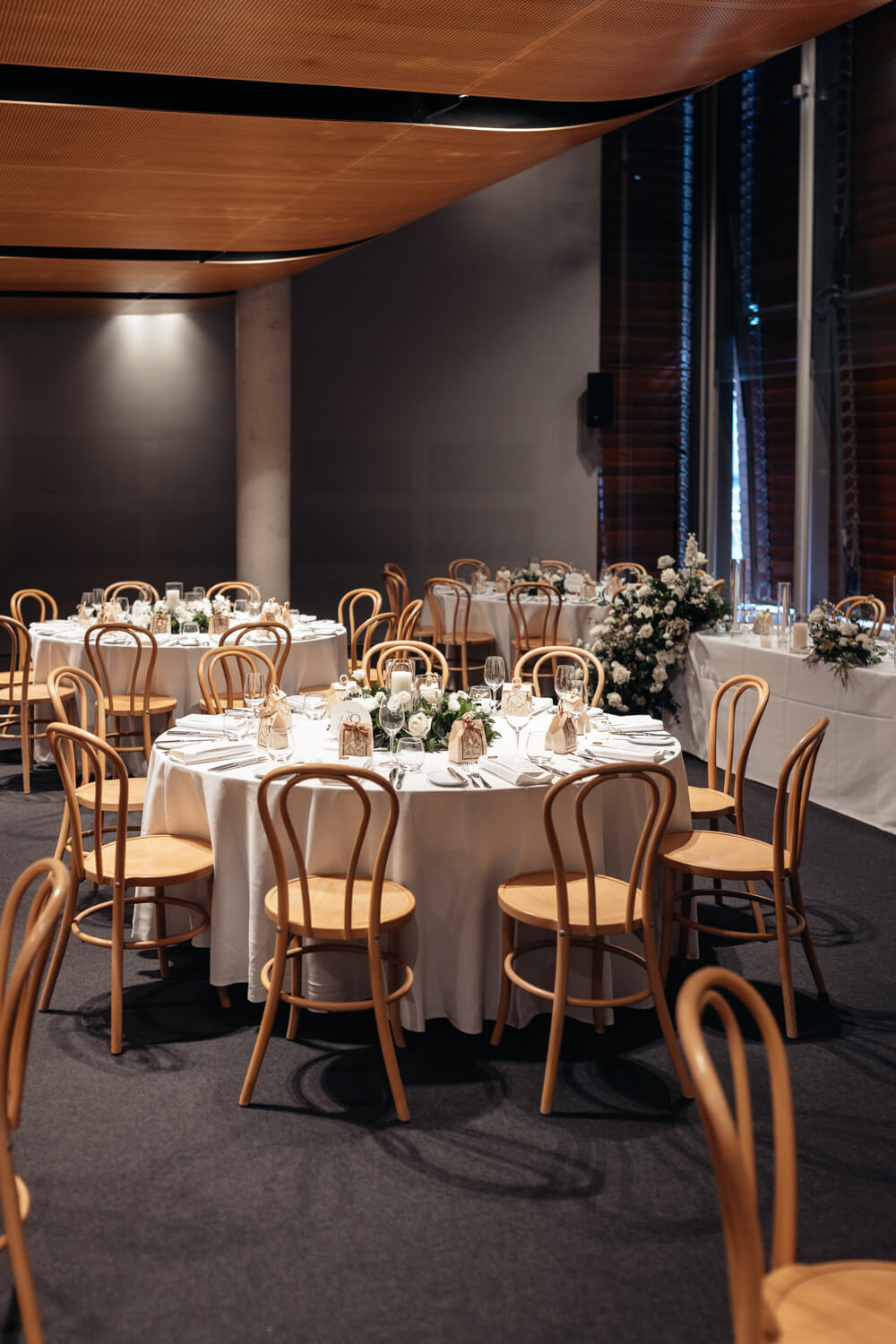 Table and chairs inside a reception room at The Mint
