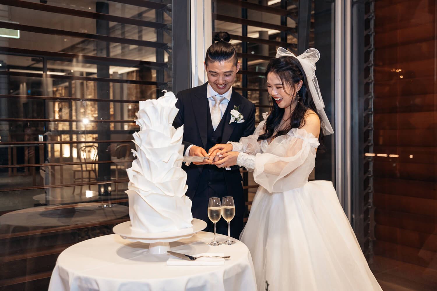 Bride and groom cutting their wedding cake at The Mint