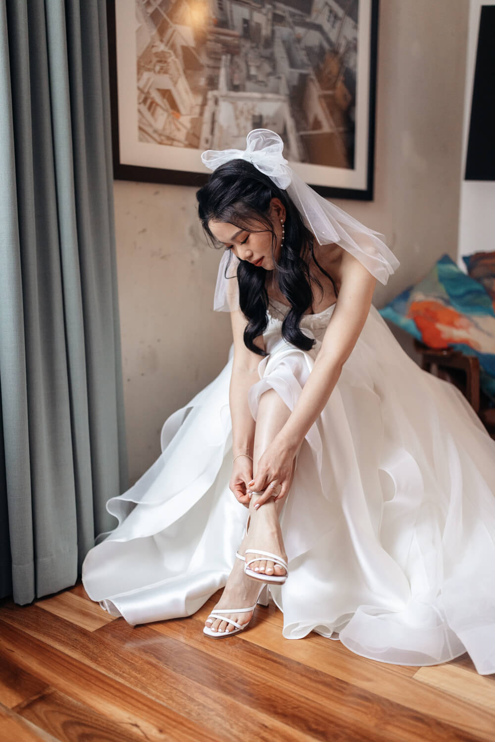 A bride putting her shows on at The Old Clare Hotel in Sydney