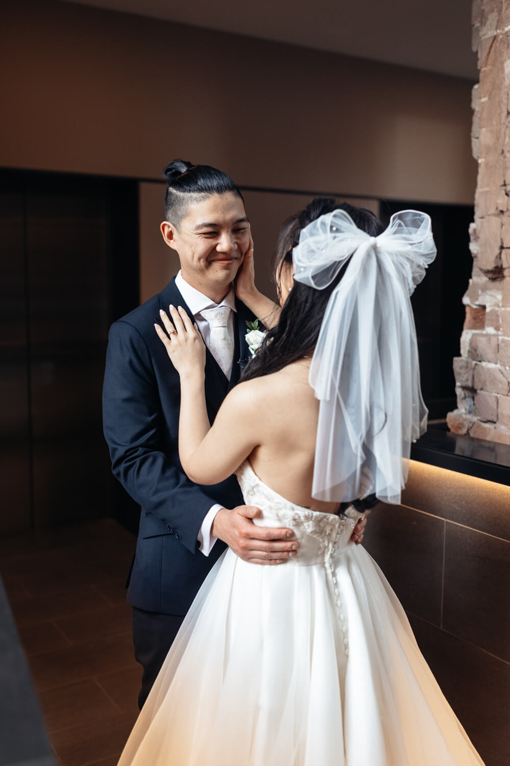 Bride and groom looking at each other following their wedding first look at The Old Clare Hotel in Sydney