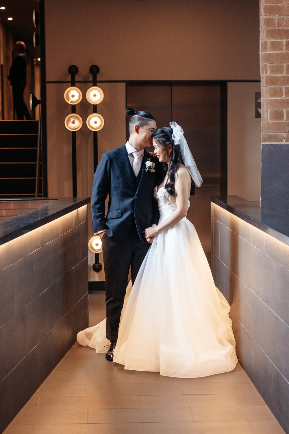 groom kissing his bride on their wedding day at The Old Clare Hotel in Sydney