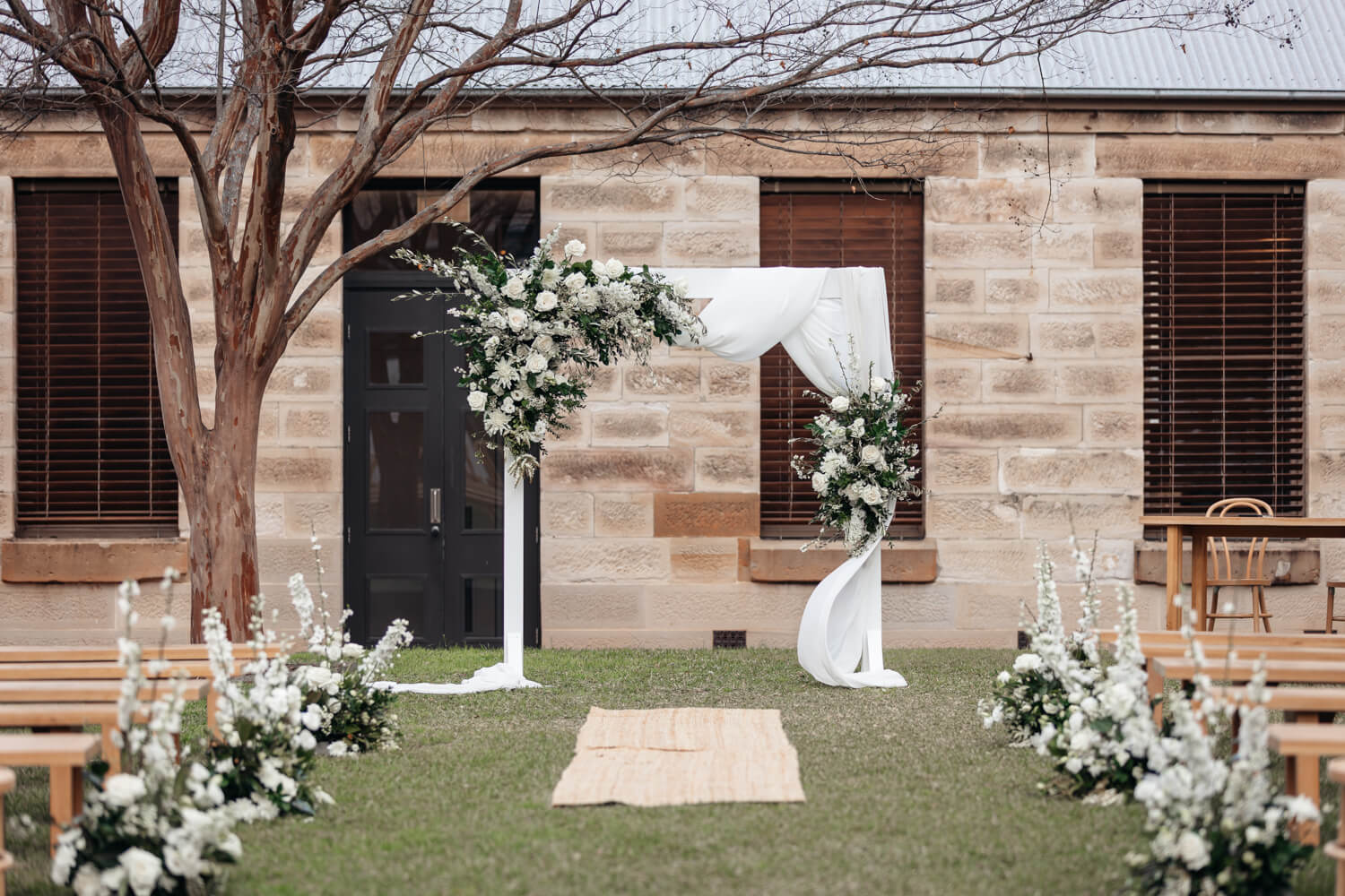 Arbour at the end of the aisle during a The Mint wedding